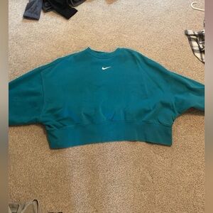 Teal Nike crop hoodie.